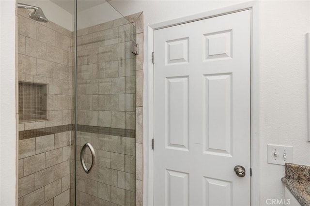 full bath with a shower stall