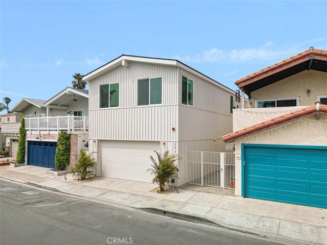 207 Canal St, Newport Beach, CA 92663 - view of front of house with a garage