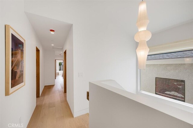 207 Canal St, Newport Beach, CA 92663 - hallway with light wood finished floors and recessed lighting
