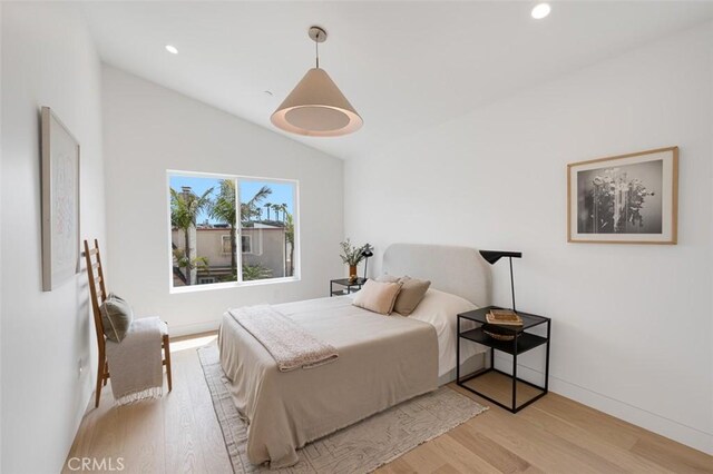 207 Canal St, Newport Beach, CA 92663 - bedroom featuring light wood-type flooring, lofted ceiling, and recessed lighting