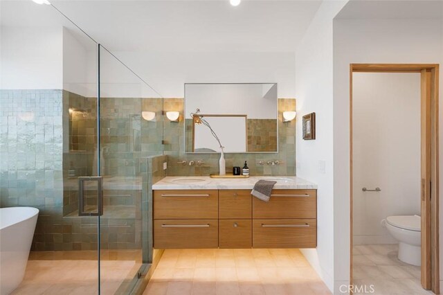 207 Canal St, Newport Beach, CA 92663 - bathroom featuring vanity, tile patterned floors, a freestanding bath, a stall shower, and decorative backsplash