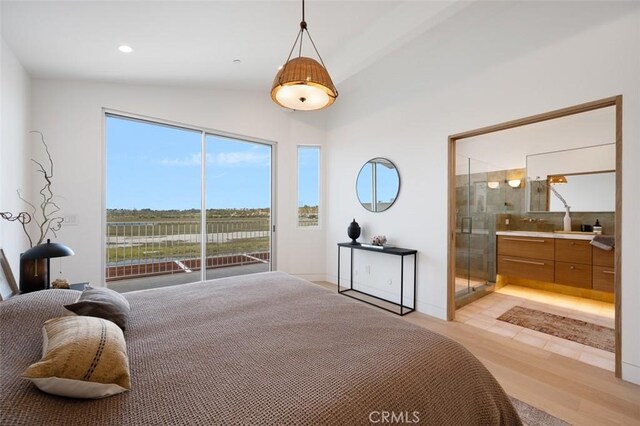 207 Canal St, Newport Beach, CA 92663 - bedroom with vaulted ceiling, access to outside, and ensuite bathroom