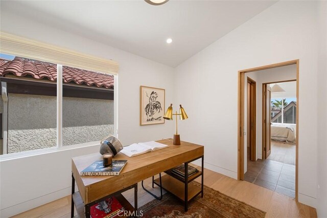 207 Canal St, Newport Beach, CA 92663 - office area with lofted ceiling and wood finished floors