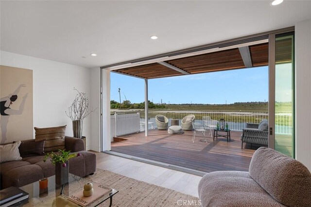 207 Canal St, Newport Beach, CA 92663 - living area featuring wood finished floors and recessed lighting