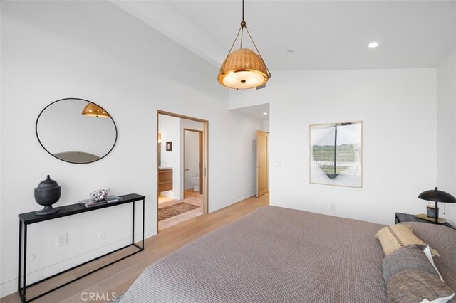 207 Canal St, Newport Beach, CA 92663 - bedroom with light wood finished floors, high vaulted ceiling, and ensuite bathroom