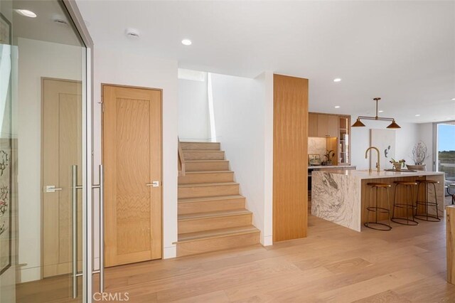 207 Canal St, Newport Beach, CA 92663 - stairway featuring wood finished floors and recessed lighting