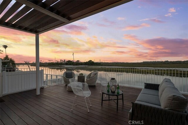 207 Canal St, Newport Beach, CA 92663 - deck at dusk featuring a water view