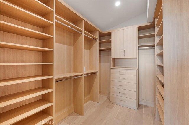207 Canal St, Newport Beach, CA 92663 - spacious closet featuring light wood-style floors and vaulted ceiling