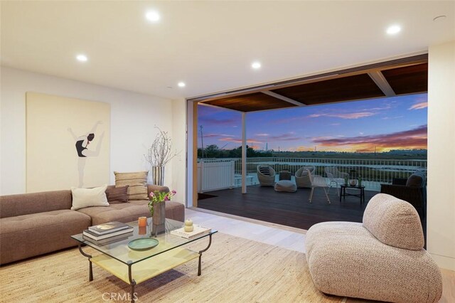 207 Canal St, Newport Beach, CA 92663 - living room with recessed lighting, wood finished floors, and a wall of windows