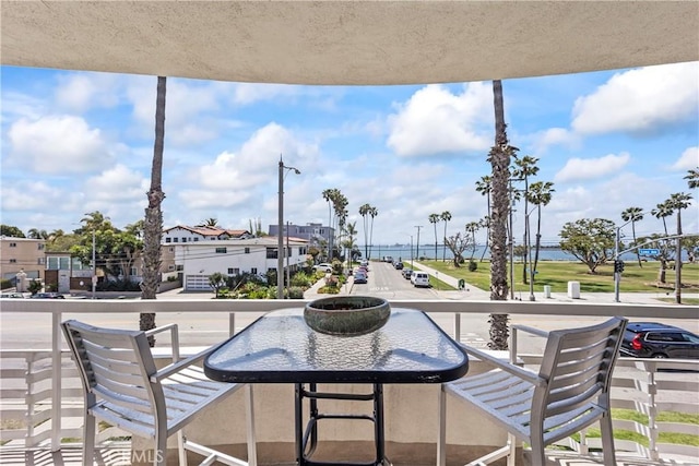 view of patio featuring a balcony