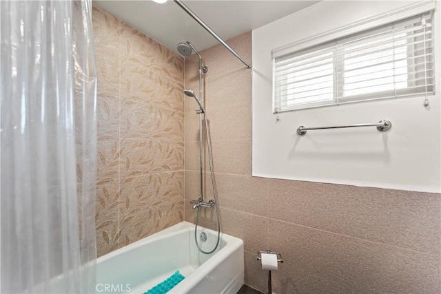 bathroom with shower / tub combo with curtain