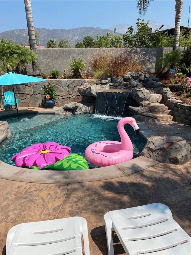 305 W 23rd St, Upland, CA 91784 - view of yard featuring a fenced in pool and a mountain view
