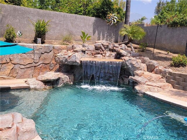 305 W 23rd St, Upland, CA 91784 - view of swimming pool featuring a fenced in pool and a fenced backyard