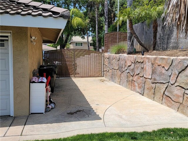 305 W 23rd St, Upland, CA 91784 - view of patio / terrace with a gate