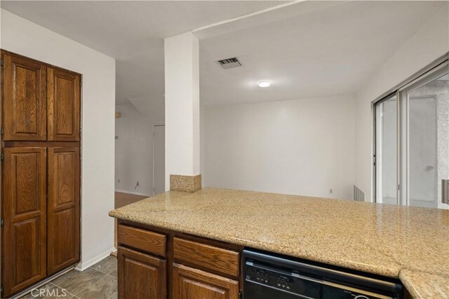 kitchen featuring visible vents and dishwasher
