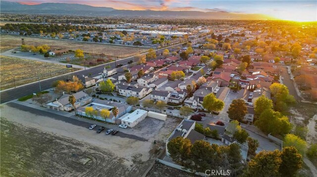 birds eye view of property with a residential view and a mountain view