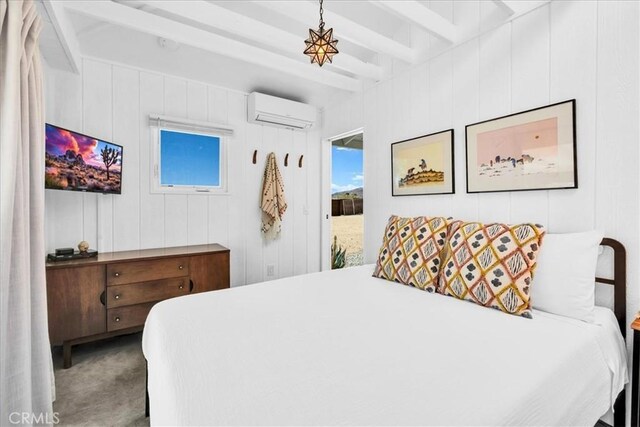 2837 Border Ave, Joshua Tree, CA 92252 - bedroom with a wall mounted air conditioner, beam ceiling, and carpet