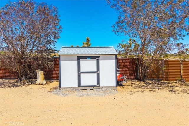 view of shed with a fenced backyard