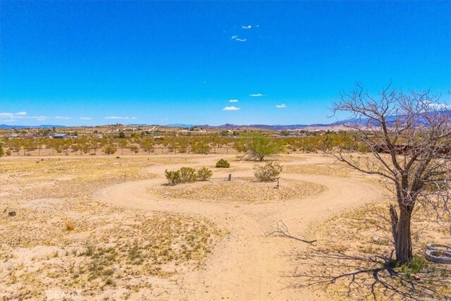 exterior space with view of desert and a rural view