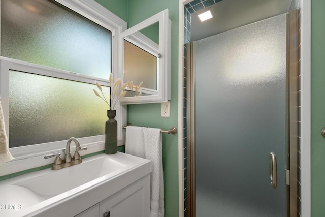 bathroom with vanity and a stall shower