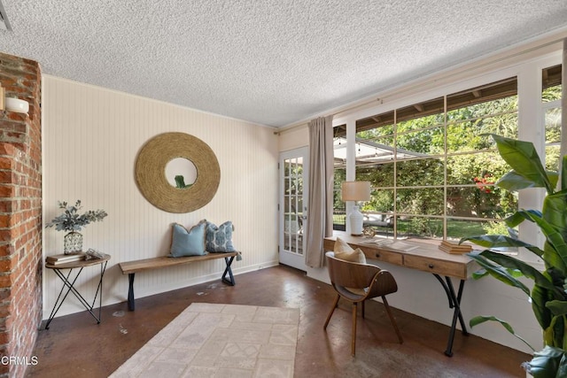 home office with finished concrete floors and a textured ceiling