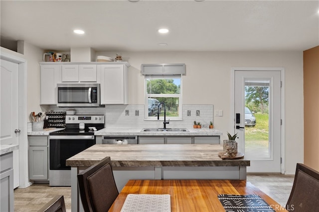 5736 La Porte Rd, Bangor, CA 95914 - kitchen featuring stainless steel appliances, wooden counters, a sink, and a healthy amount of sunlight