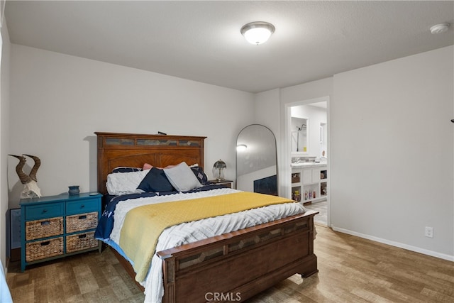 5736 La Porte Rd, Bangor, CA 95914 - bedroom with baseboards, wood finished floors, and connected bathroom