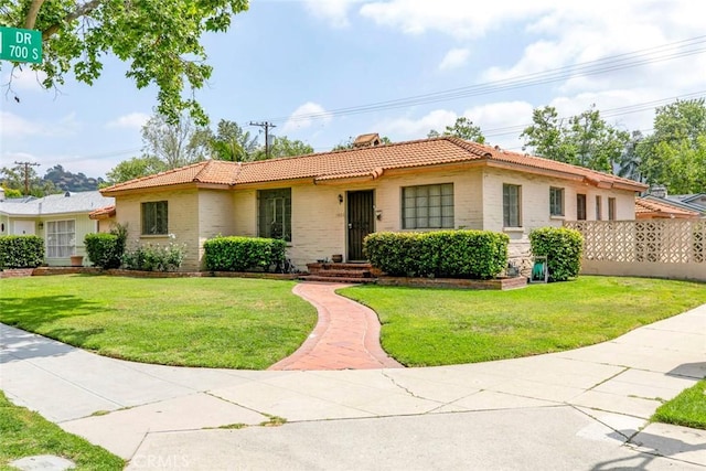 1422 W Riverside Dr, Burbank, CA 91506 - single story home featuring a tiled roof, brick siding, and a front yard