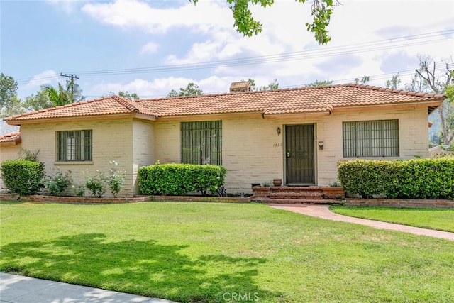 1422 W Riverside Dr, Burbank, CA 91506 - ranch-style home featuring a front yard, a tiled roof, and a chimney