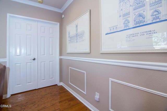 interior space with baseboards, ornamental molding, and dark wood finished floors