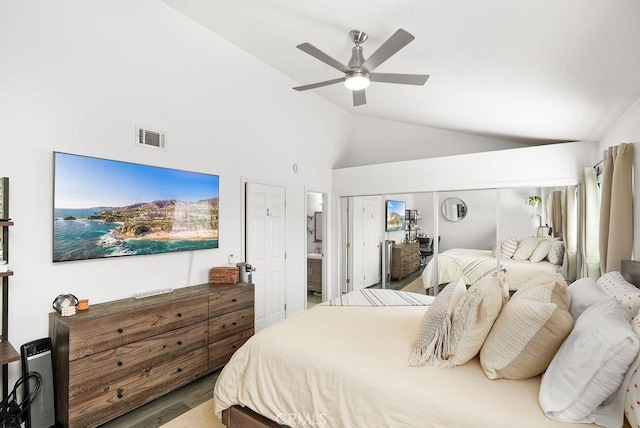 bedroom with high vaulted ceiling, a ceiling fan, wood finished floors, and visible vents