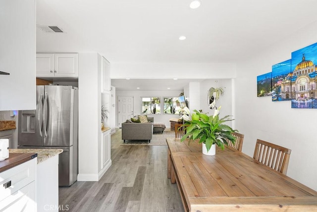 30 Starfish Ct Unit 14, Newport Beach, CA 92663 - dining area featuring light wood-type flooring, visible vents, and recessed lighting