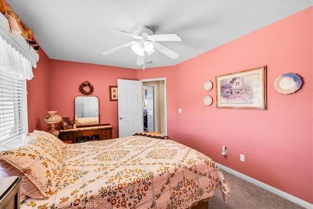 bedroom featuring carpet floors, baseboards, and ceiling fan