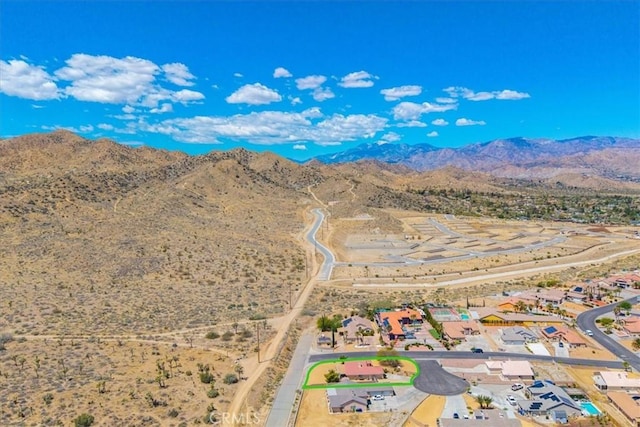 bird's eye view with a mountain view and a desert view