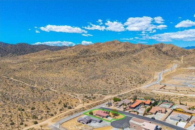 bird's eye view featuring a rural view, a mountain view, and view of desert