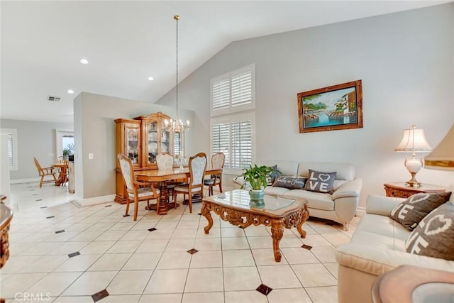 living room featuring light tile patterned floors, visible vents, a wealth of natural light, and an inviting chandelier