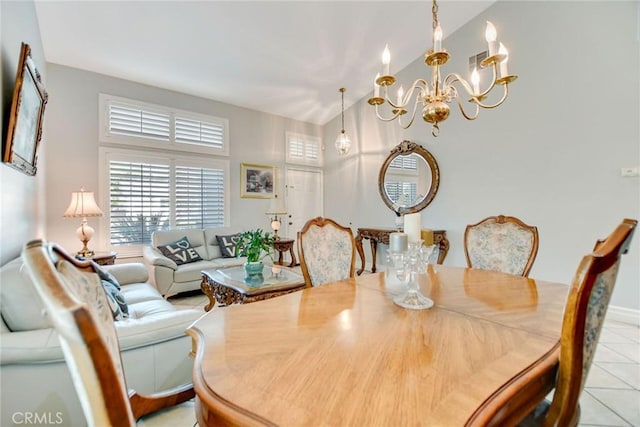 dining area with an inviting chandelier and light tile patterned floors