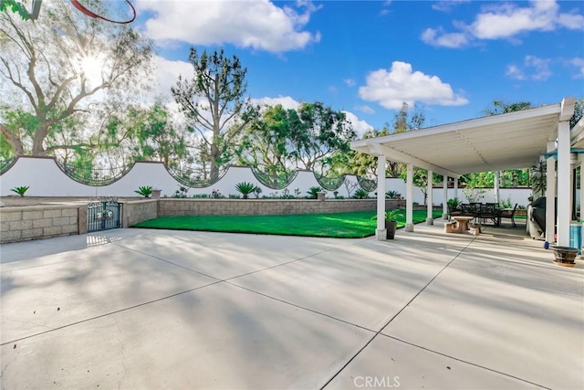 view of home's community with fence private yard, a gate, and a patio area