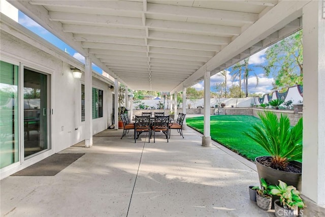 view of patio featuring outdoor dining area and a fenced backyard