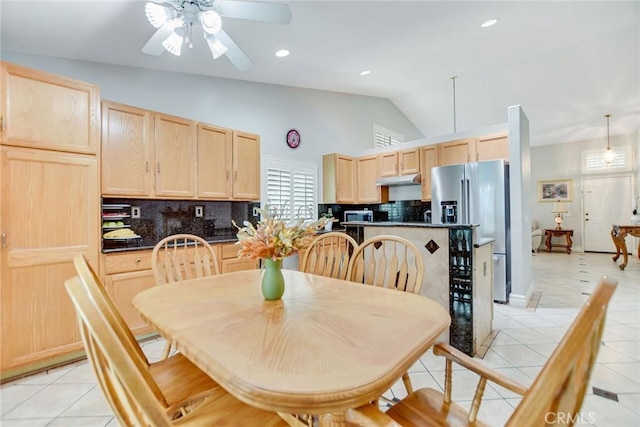 dining room with light tile patterned floors, high vaulted ceiling, ceiling fan, and recessed lighting
