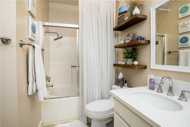 full bathroom featuring vanity, toilet, and shower / bath combination with glass door