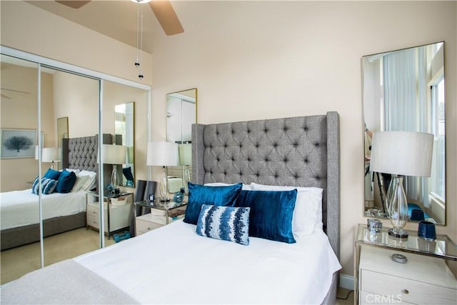 bedroom with a ceiling fan and a closet