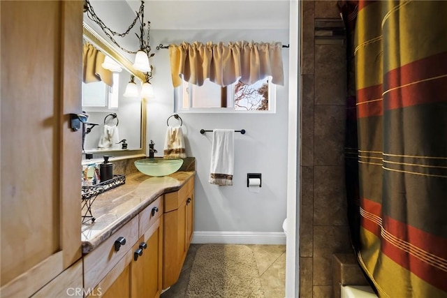 2450 Cameron Ave, Covina, CA 91724 - bathroom featuring baseboards, shower / tub combo with curtain, tile patterned flooring, and vanity