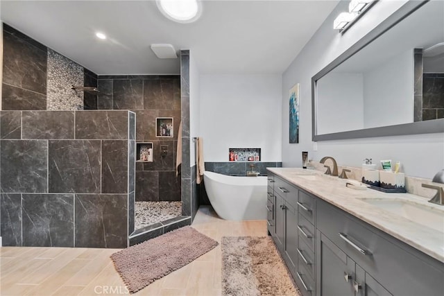 2450 Cameron Ave, Covina, CA 91724 - full bathroom featuring double vanity, a sink, a freestanding tub, and walk in shower