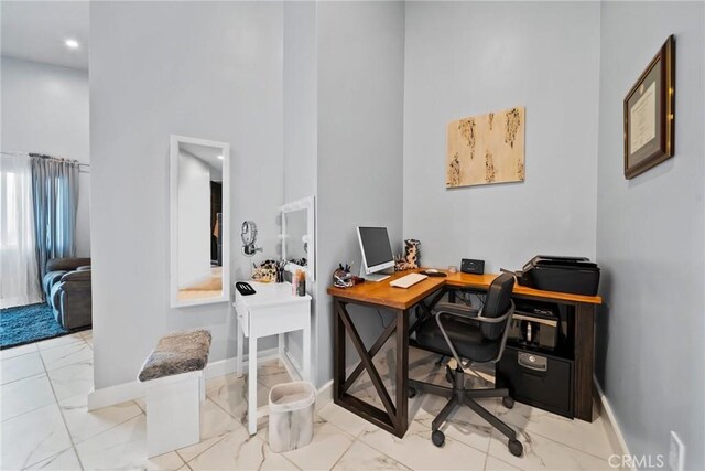 2450 Cameron Ave, Covina, CA 91724 - office with baseboards, a high ceiling, and marble finish floor