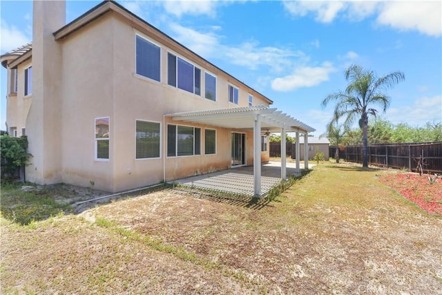 19131 Camassia Ct, Riverside, CA 92508 - rear view of property featuring a pergola, a fenced backyard, stucco siding, a patio, and a chimney
