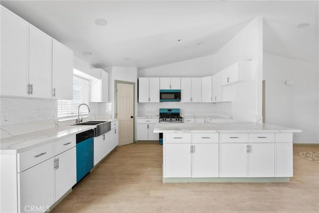 12185 Atsina Rd, Phelan, CA 92371 - kitchen featuring backsplash, stainless steel range with gas stovetop, vaulted ceiling, dishwasher, and a sink