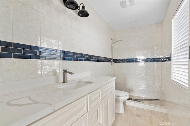 12185 Atsina Rd, Phelan, CA 92371 - bathroom featuring vanity, tile walls, a tile shower, and toilet