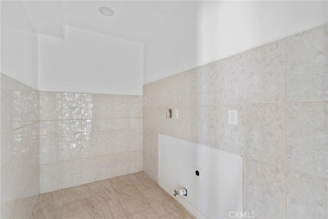 12185 Atsina Rd, Phelan, CA 92371 - bathroom featuring tile walls