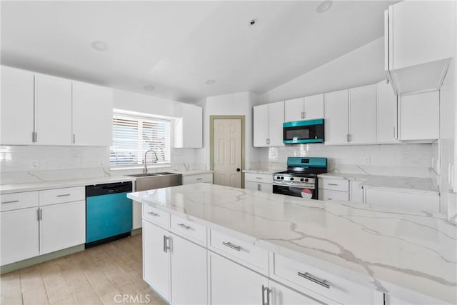 12185 Atsina Rd, Phelan, CA 92371 - kitchen featuring dishwashing machine, white cabinetry, a sink, and gas range